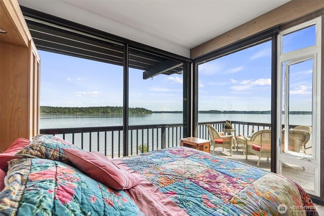 9716 Hunter Point Rd NW, Olympia, WA 98502 - bedroom with access to exterior, a water view, and multiple windows