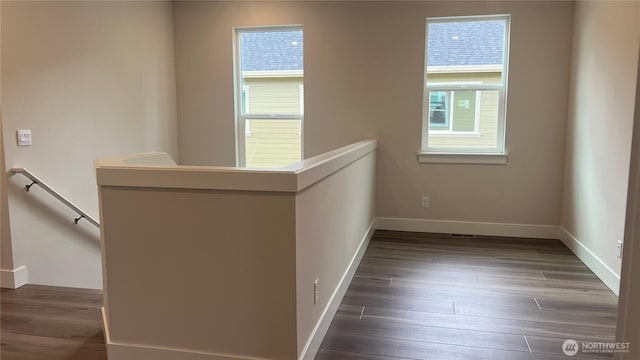 6406 213th Avenue Ct E, Bonney Lake, WA 98391 - hall with an upstairs landing, dark wood-style floors, and baseboards