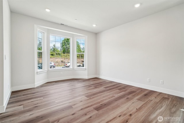 6406 213th Avenue Ct E, Bonney Lake, WA 98391 - unfurnished room with wood finished floors and recessed lighting