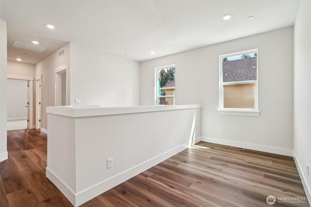 6406 213th Avenue Ct E, Bonney Lake, WA 98391 - hallway with wood finished floors, recessed lighting, and an upstairs landing