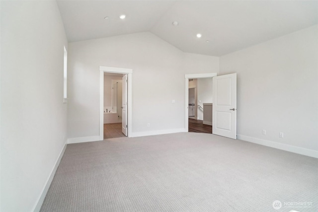 6406 213th Avenue Ct E, Bonney Lake, WA 98391 - unfurnished bedroom with carpet floors, lofted ceiling, recessed lighting, and ensuite bath