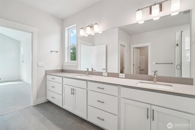 6406 213th Avenue Ct E, Bonney Lake, WA 98391 - bathroom featuring double vanity and baseboards