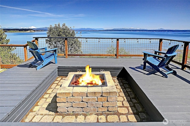 987 Cavalero Rd, Camano Island, WA 98282 - wooden deck featuring a fire pit and a water view