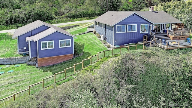 987 Cavalero Rd, Camano Island, WA 98282 - exterior space with a lawn, a wooden deck, a fenced backyard, and a forest view