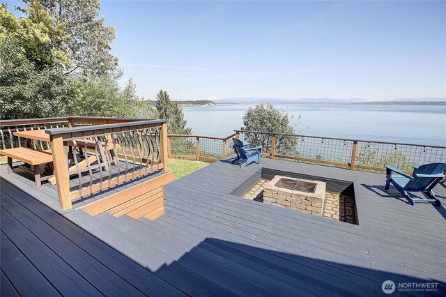 987 Cavalero Rd, Camano Island, WA 98282 - wooden terrace with an outdoor fire pit and a water view