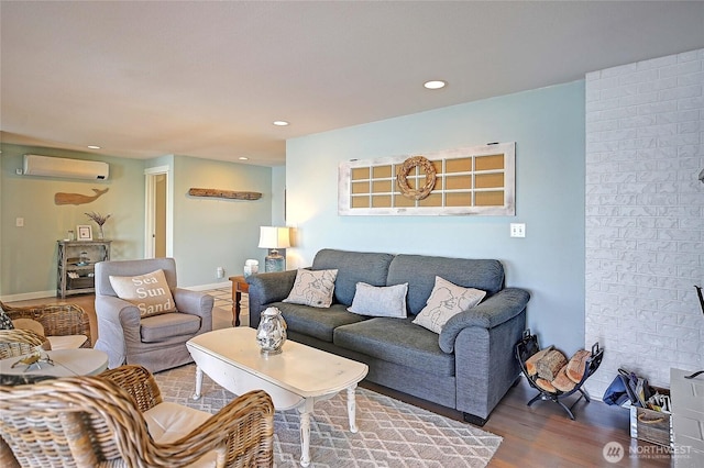 987 Cavalero Rd, Camano Island, WA 98282 - living area featuring recessed lighting, a wall unit AC, and wood finished floors