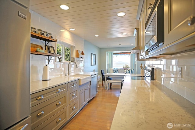 987 Cavalero Rd, Camano Island, WA 98282 - kitchen with open shelves, a sink, appliances with stainless steel finishes, a healthy amount of sunlight, and recessed lighting