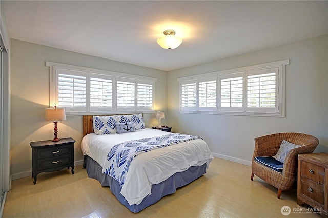 987 Cavalero Rd, Camano Island, WA 98282 - bedroom featuring light wood-type flooring and baseboards