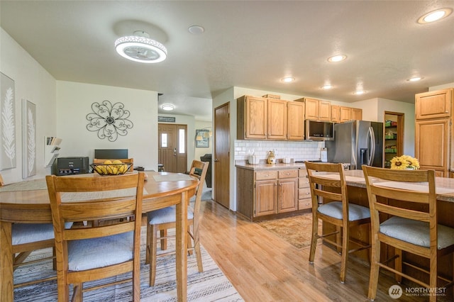 192 Canal Dr NE, Ocean Shores, WA 98569 - kitchen with stainless steel appliances, light wood finished floors, light countertops, decorative backsplash, and recessed lighting