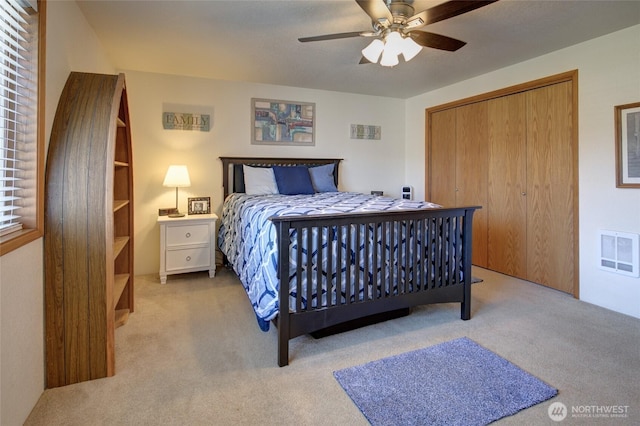 192 Canal Dr NE, Ocean Shores, WA 98569 - bedroom with carpet flooring, a closet, and a ceiling fan