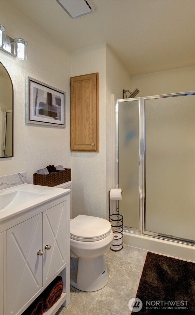 192 Canal Dr NE, Ocean Shores, WA 98569 - bathroom with a shower stall, vanity, and toilet