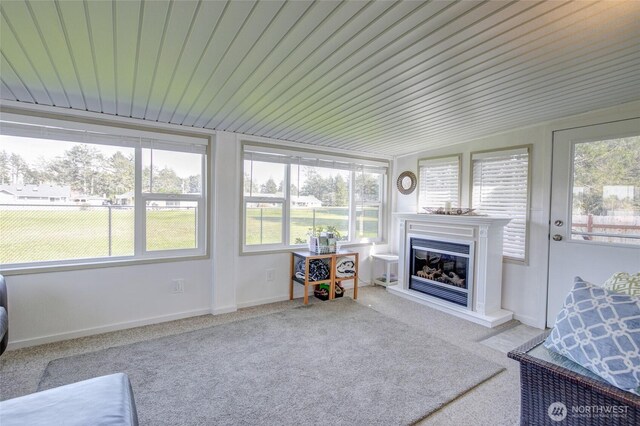 192 Canal Dr NE, Ocean Shores, WA 98569 - sunroom with plenty of natural light, carpet, and wood ceiling