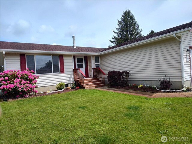 192 Canal Dr NE, Ocean Shores, WA 98569 - ranch-style home with a front lawn