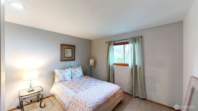 carpeted bedroom with baseboards