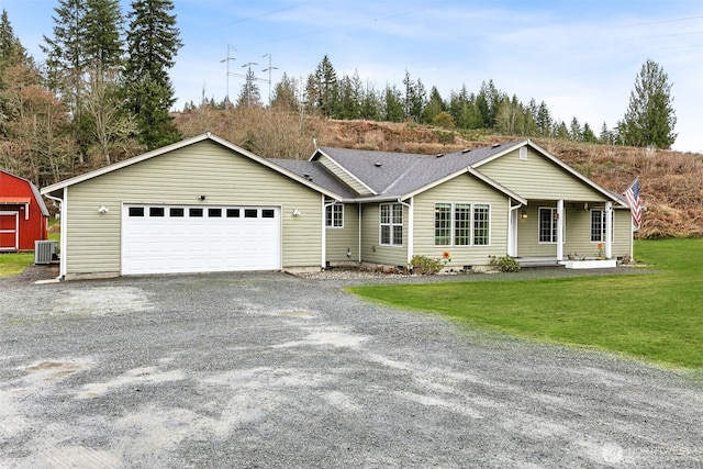 single story home featuring central air condition unit, driveway, a front yard, and an attached garage