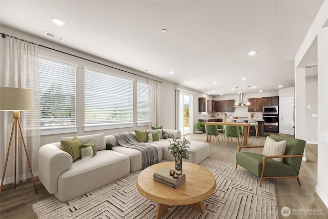 16226 SE 133rd Pl Unit 104, Renton, WA 98059 - living room featuring light wood-style floors, recessed lighting, and baseboards