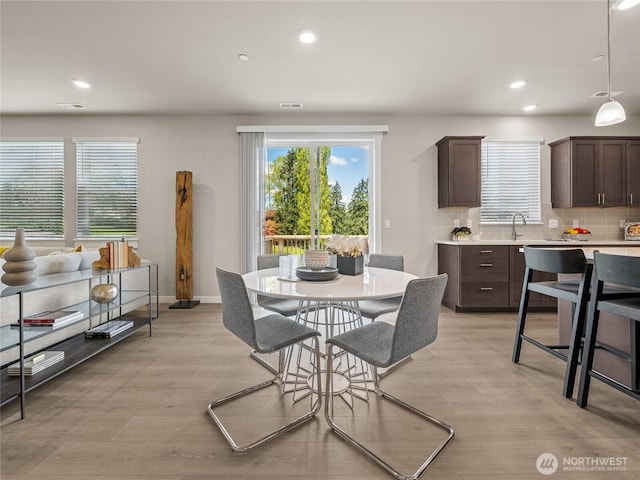 16226 SE 133rd Pl Unit 104, Renton, WA 98059 - dining room with light wood-style floors, recessed lighting, and baseboards