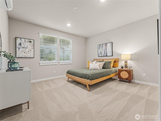 16226 SE 133rd Pl Unit 104, Renton, WA 98059 - bedroom with baseboards, a wall mounted air conditioner, light colored carpet, and recessed lighting