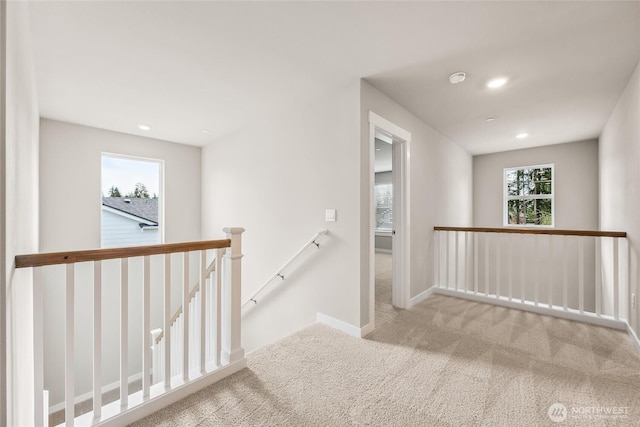16226 SE 133rd Pl Unit 104, Renton, WA 98059 - corridor featuring an upstairs landing, carpet, baseboards, and recessed lighting
