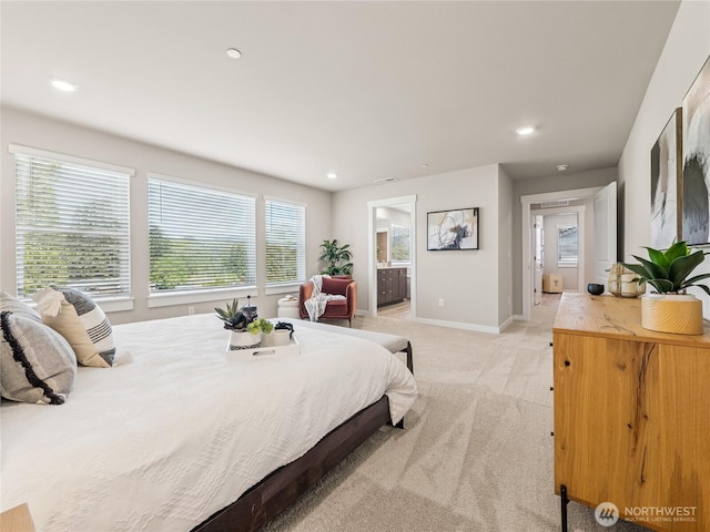 16226 SE 133rd Pl Unit 104, Renton, WA 98059 - bedroom featuring light colored carpet, recessed lighting, baseboards, and ensuite bath