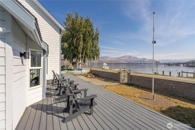 117 Water St, Chelan, WA 98816 - deck featuring a water and mountain view and fence