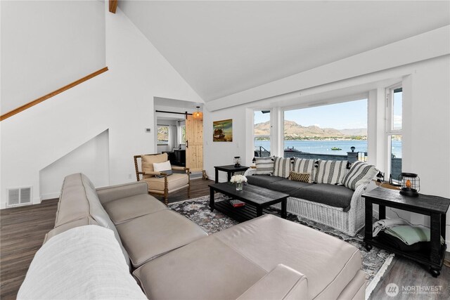 117 Water St, Chelan, WA 98816 - living room with wood finished floors, high vaulted ceiling, visible vents, and a water view