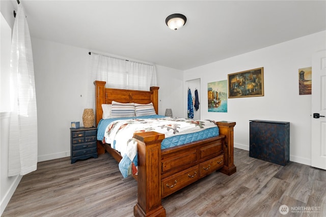 117 Water St, Chelan, WA 98816 - bedroom with a closet, baseboards, and wood finished floors