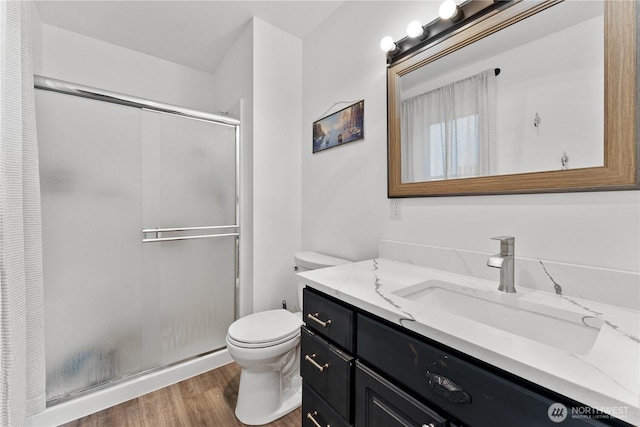 117 Water St, Chelan, WA 98816 - bathroom with a shower stall, vanity, toilet, and wood finished floors