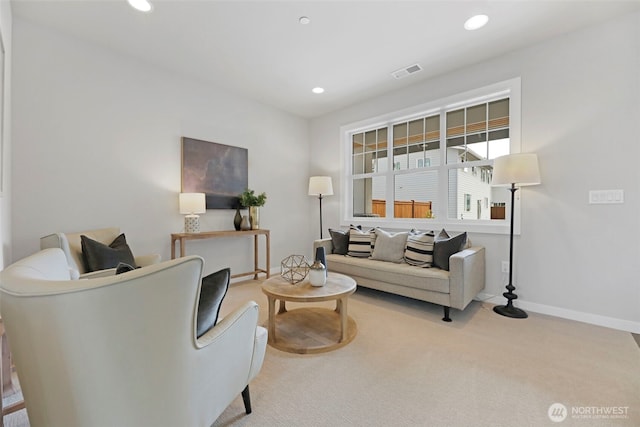 living room with carpet flooring, recessed lighting, baseboards, and visible vents