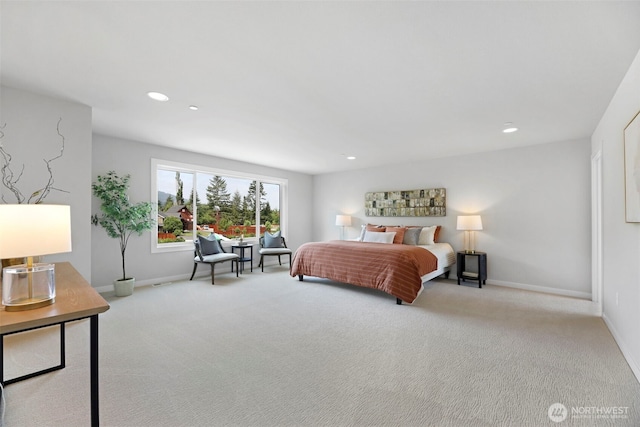 bedroom featuring light colored carpet and recessed lighting