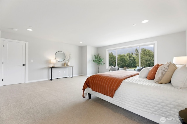 carpeted bedroom featuring baseboards and recessed lighting