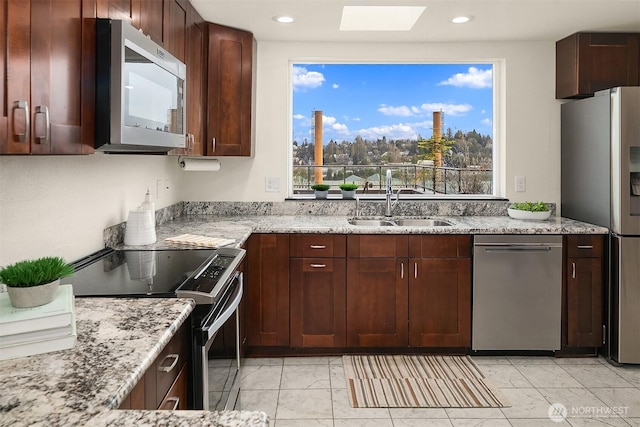 3022 SW Bradford St Unit 401, Seattle, WA 98126 - kitchen featuring a sink, recessed lighting, appliances with stainless steel finishes, and light stone counters