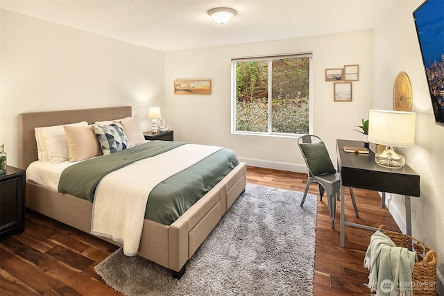 3022 SW Bradford St Unit 401, Seattle, WA 98126 - bedroom with baseboards and dark wood-style floors