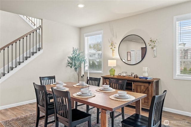 22819 SE Fir St, Black Diamond, WA 98010 - dining room with wood finished floors, a wealth of natural light, and stairway