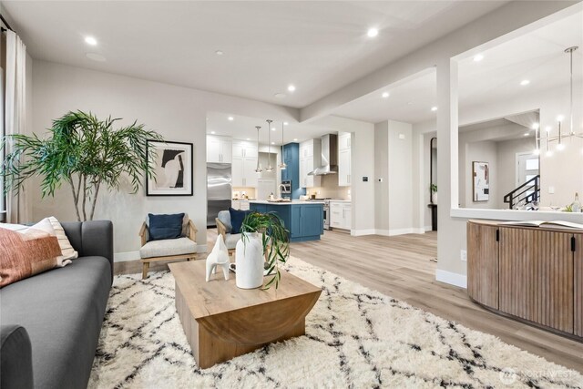 16306 SE 133rd Pl Unit 105, Renton, WA 98059 - living area featuring light wood-style floors, recessed lighting, and a chandelier