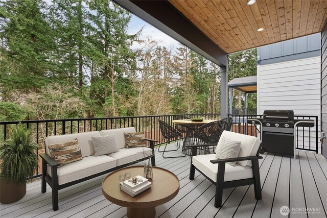 16306 SE 133rd Pl Unit 105, Renton, WA 98059 - wooden deck with outdoor dining space, outdoor lounge area, and area for grilling