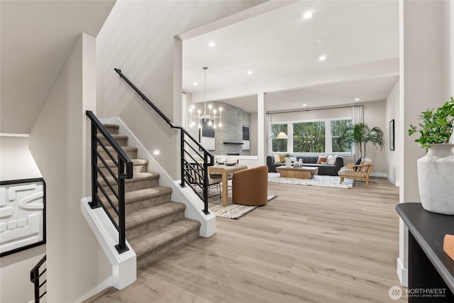 16306 SE 133rd Pl Unit 105, Renton, WA 98059 - foyer entrance featuring light wood finished floors, stairway, a chandelier, and recessed lighting