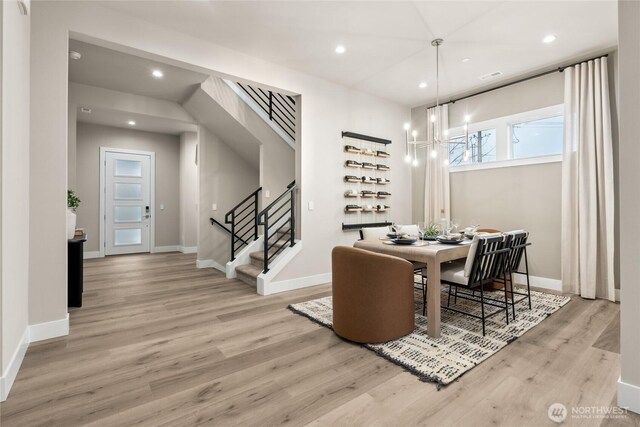 16306 SE 133rd Pl Unit 105, Renton, WA 98059 - dining area with wood finished floors, stairs, recessed lighting, and a chandelier