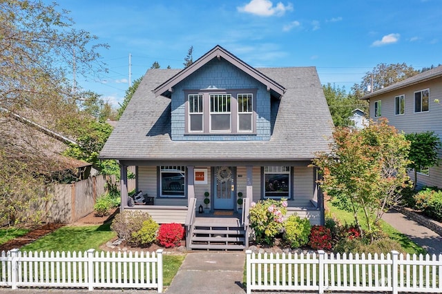 250 SE Andrews St, Issaquah, WA 98027 - view of front of property with a porch, a fenced front yard, and a shingled roof