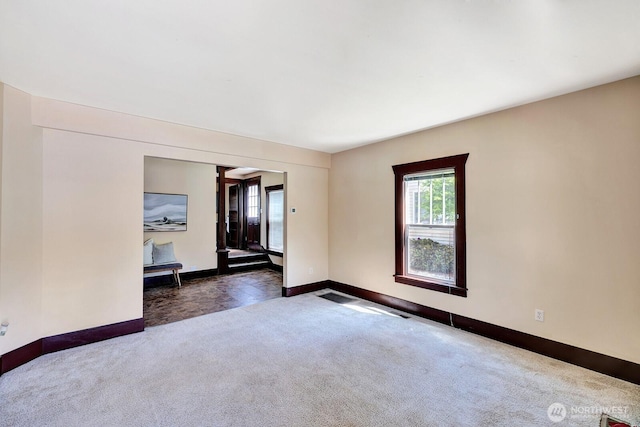 250 SE Andrews St, Issaquah, WA 98027 - empty room featuring dark carpet and baseboards