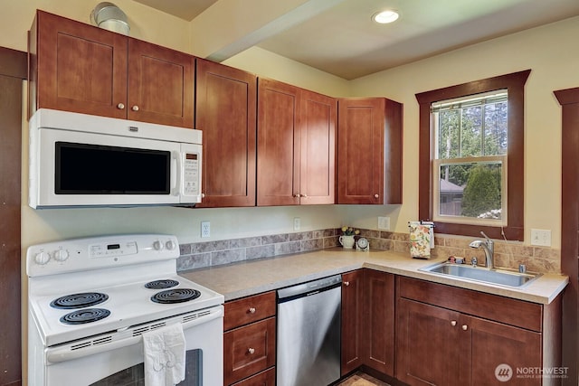 250 SE Andrews St, Issaquah, WA 98027 - kitchen featuring white appliances, a sink, and light countertops