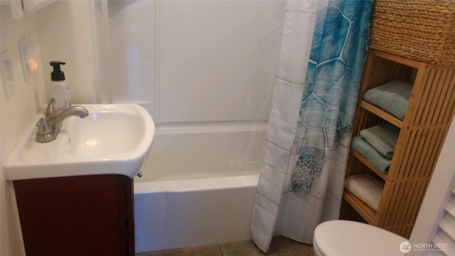 full bathroom with tile patterned floors, toilet, and vanity