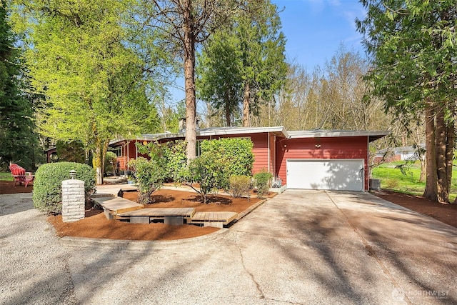 view of front of property with driveway and an attached garage