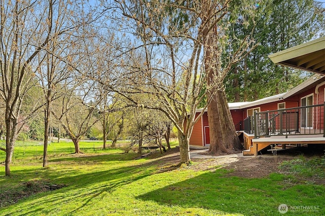 view of yard with a wooden deck