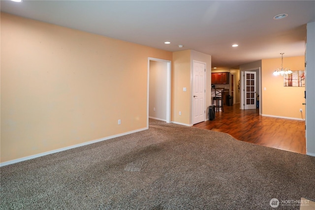 204 Brant Ln, Hoquiam, WA 98550 - unfurnished living room with baseboards, dark carpet, recessed lighting, and a chandelier