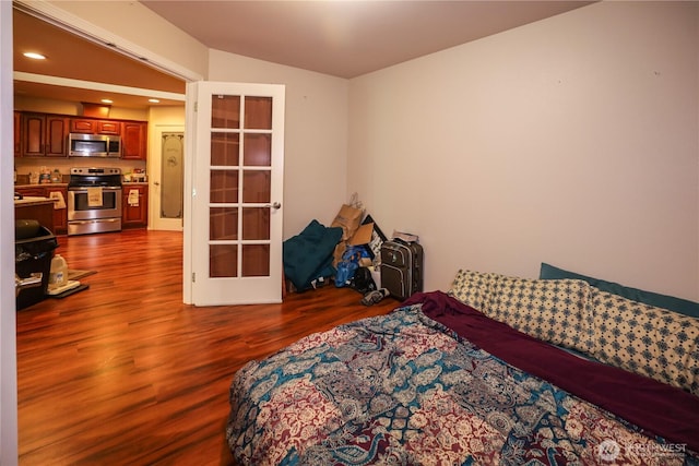 204 Brant Ln, Hoquiam, WA 98550 - bedroom with dark wood-type flooring, french doors, and recessed lighting