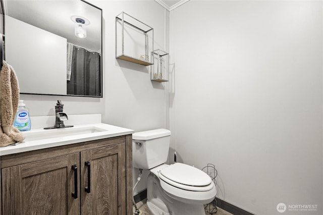14205 205th Street Ct E, Graham, WA 98338 - full bath with crown molding, baseboards, vanity, and toilet