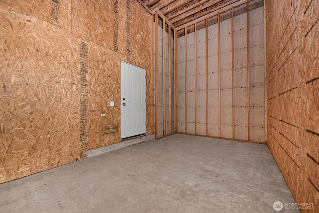 spare room with concrete floors