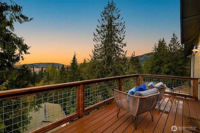 deck at dusk with a mountain view