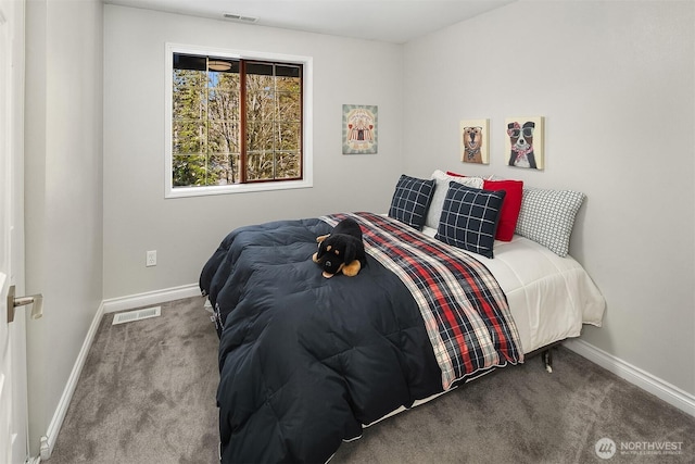carpeted bedroom featuring baseboards and visible vents